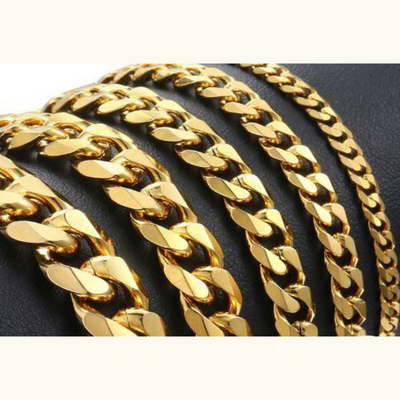 Gold chain necklace on a dark background