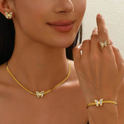 Woman showcasing full 18K Butterflies Jewelry Set including necklace, earrings, bracelet, and ring, ideal for special occasions or gifts.