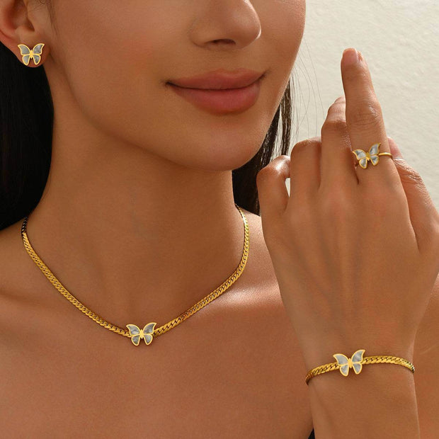 Woman showcasing full 18K Butterflies Jewelry Set including necklace, earrings, bracelet, and ring, ideal for special occasions or gifts.