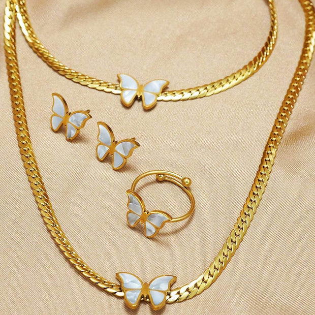 Complete 18K Butterflies Jewelry Set laid out on satin, featuring necklace, earrings, bracelet, and ring with butterfly motifs.