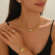 Model wearing 18K Butterflies Jewelry Set with gold-plated butterfly necklace, earrings, bracelet, and ring, ideal for gifting or daily wear.