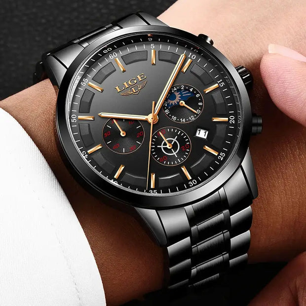Luxury watch with black dial and silver metal strap on a wrist.