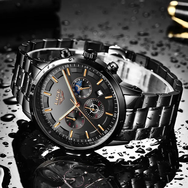 Luxury watch with black dial and metallic band on a reflective surface