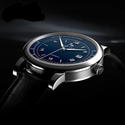 Poniger watch with blue dial and black strap on a dark background