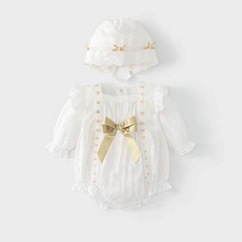 Luxurious spring baby outfit set with floral embroidery, featuring a white onesie and matching hat adorned with gold ribbon bows.