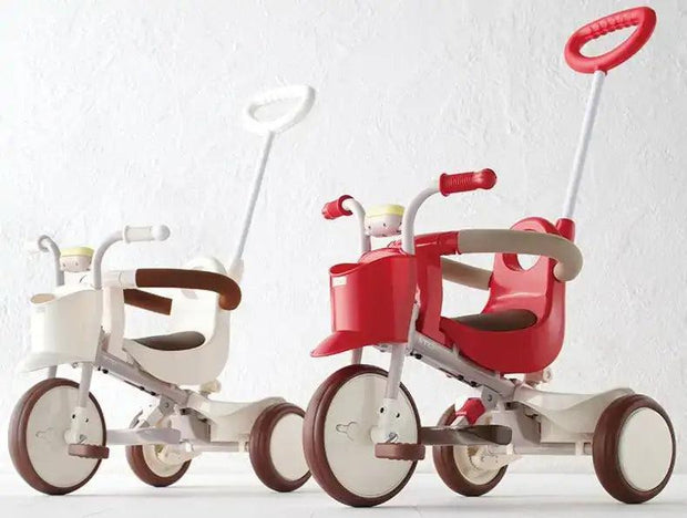 Side-by-side view of red and white iimo Tricycle (Classic Version), showcasing award-winning ergonomic design for kids' riding fun.