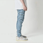 Light blue cargo jeans worn by a person on a white background
