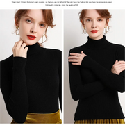 Woman wearing a black turtleneck sweater with gold pants on a plain background
