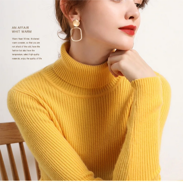 Person wearing a yellow turtleneck sweater with a blurred background
